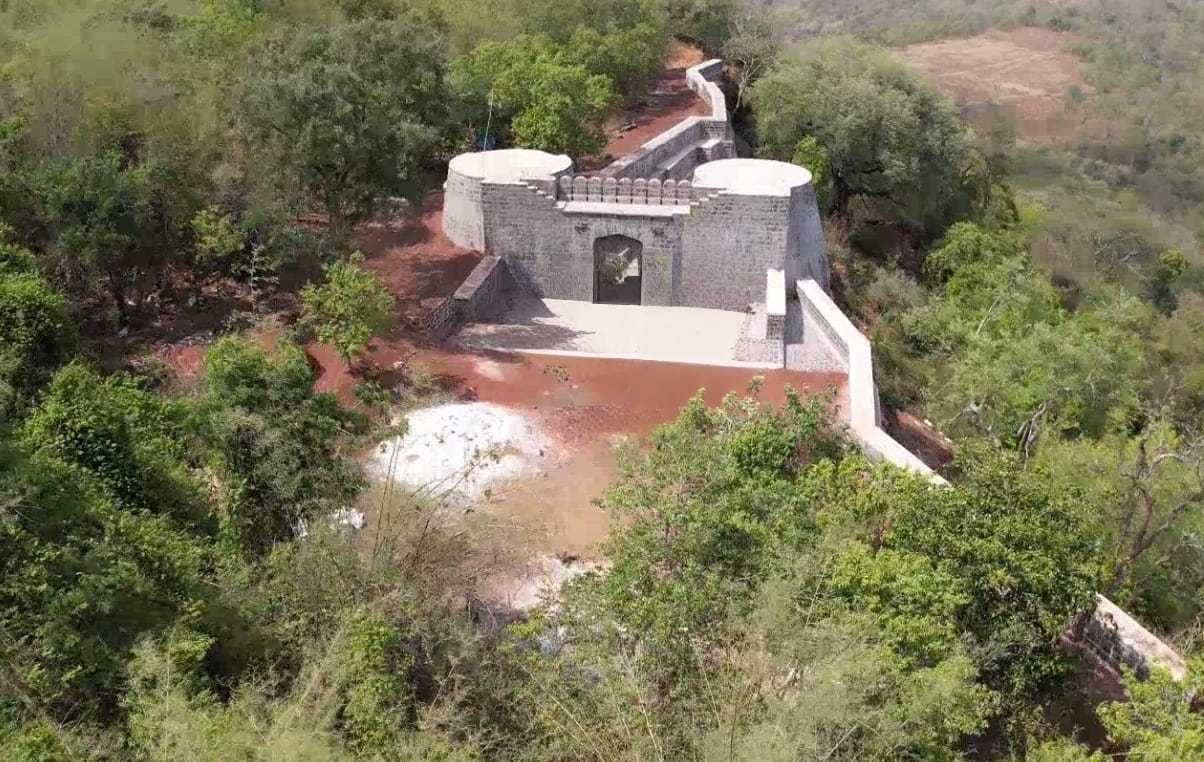 Aerial view of the restored ramparts and gateway of Manikgad Fort
